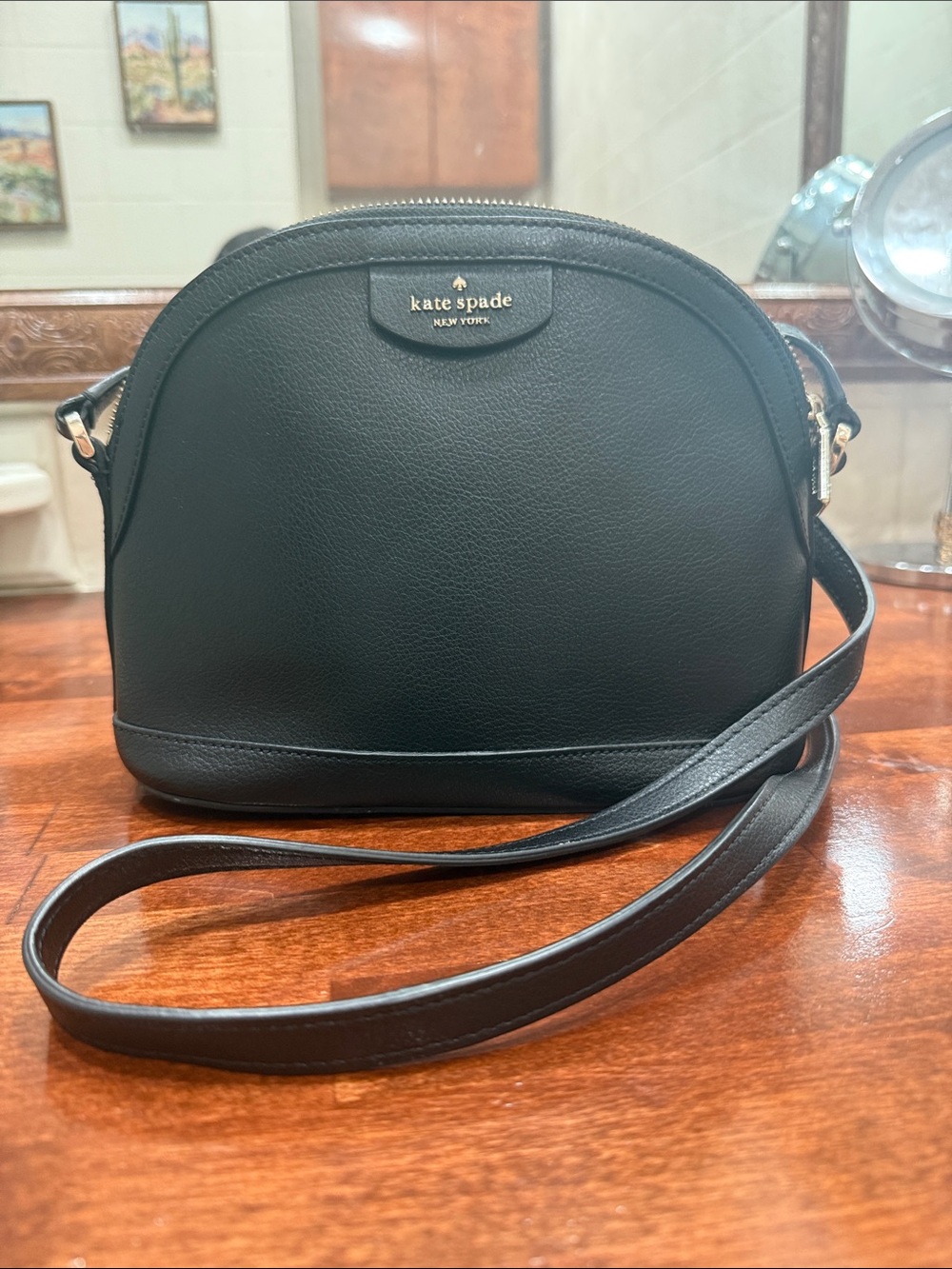 kate spade black leather dome crossbody bag with gold logo